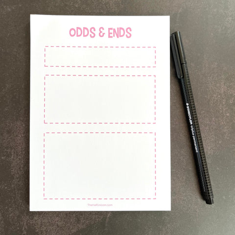 Odds and Ends Notepad has three different sized boxed off areas in small, medium, and large. White paper with pale pink lettering.